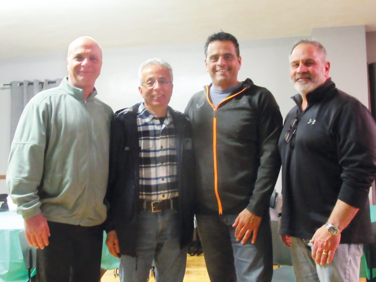 HAPPY HOST: Former State Rep. John Carnevale, who is now helping expand the Di Fesa Society expand its programs and facility, welcomes Johnston Town Council President Robert V. Russo, School Committee Chairman Bob LaFazia and Vice Chairman Joe Rotella to last week’s JDTC reorganizational meeting.